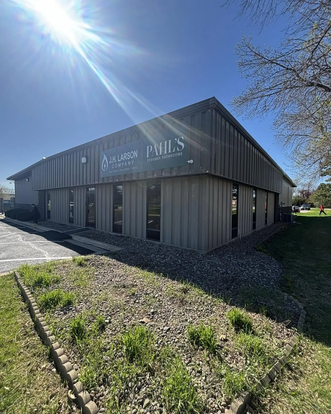 Freshly painted gray metal commercial building exterior in Rochester, MN